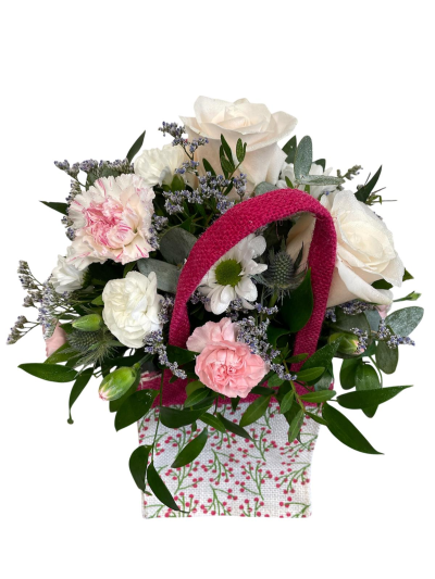 A Little Something - Show your affection with this mouth-watering mix of classical flowers delivered in a delightful gift bag or box.